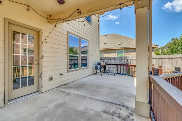 a view of a balcony with chairs