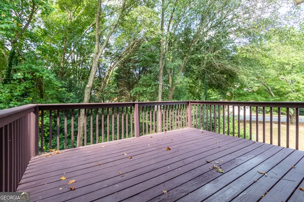 a balcony with wooden floor