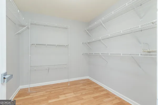 a bathroom with a shower and a window