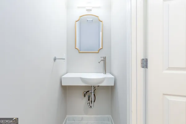 a view of a bathroom from a hallway