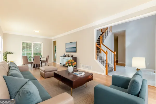 a living room with furniture or couch and a window