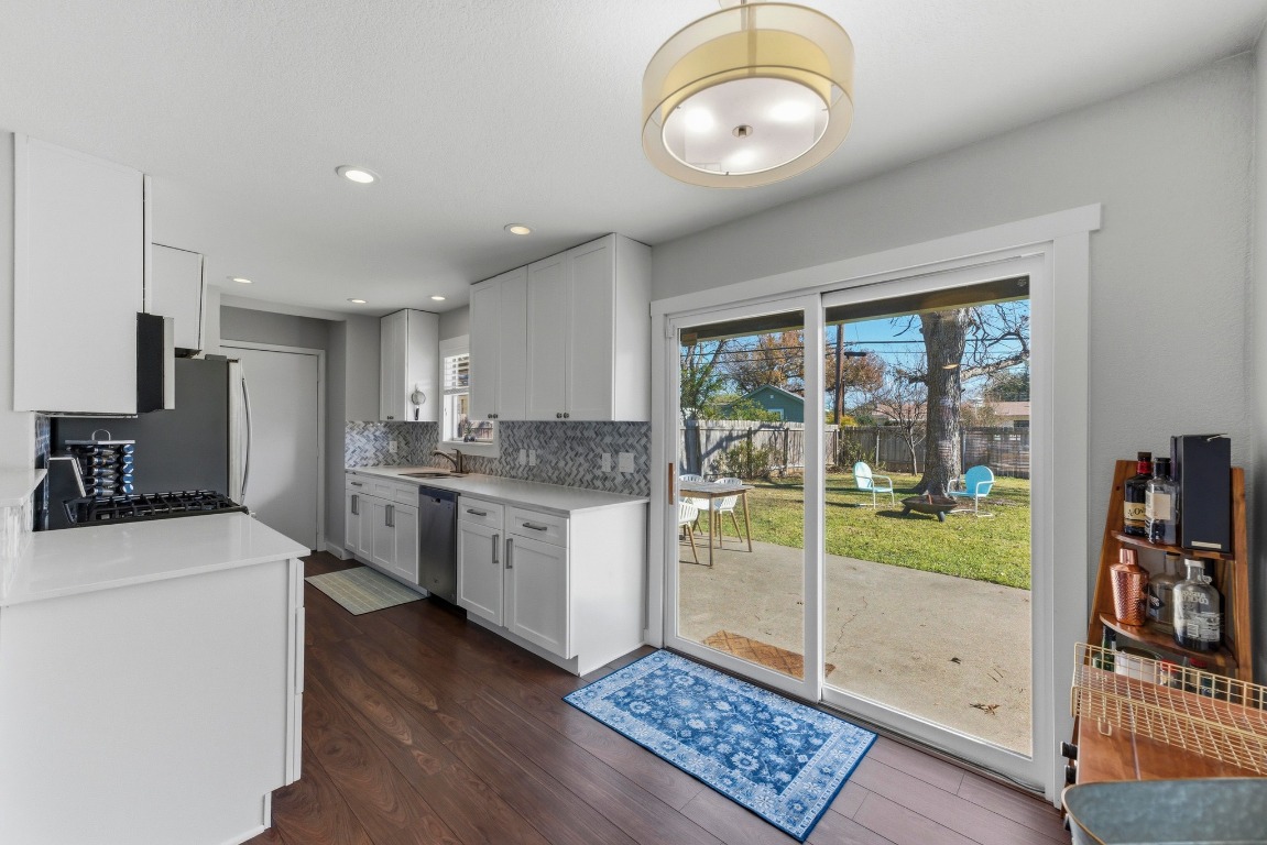 1801 Ohlen Road Austin, TX 78757 - Photo 11 of 29 a kitchen with sink refrigerator and stove