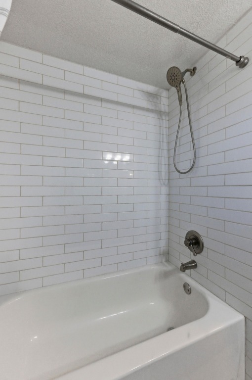 1801 Ohlen Road Austin, TX 78757 - Photo 19 of 29 a bathroom with a shower and a bathtub