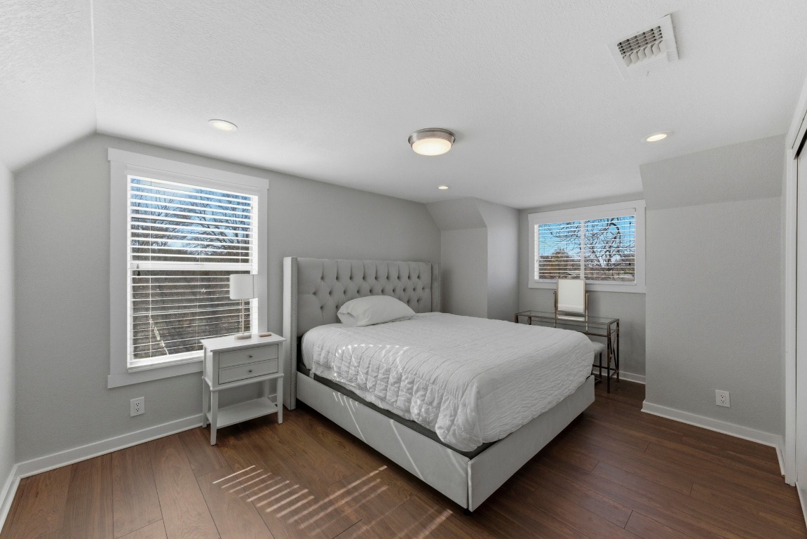 1801 Ohlen Road Austin, TX 78757 - Photo 20 of 29 a bedroom with a bed and a window