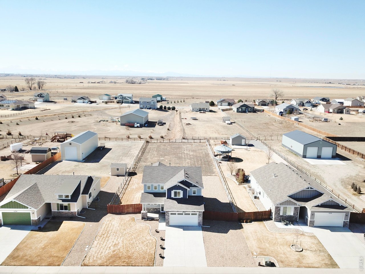 1215 5th Street Pierce, CO 80650 - Photo 20 of 22 an aerial view of residential houses with outdoor space