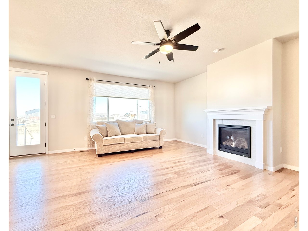 1215 5th Street Pierce, CO 80650 - Photo 7 of 22 a living room with a couches and a fireplace