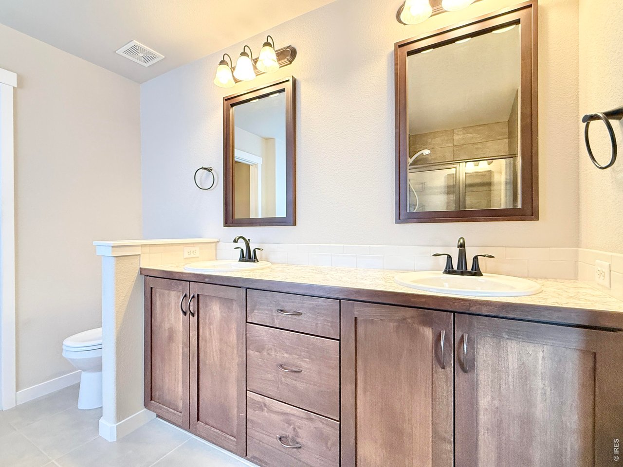 1215 5th Street Pierce, CO 80650 - Photo 10 of 22 a bathroom with a granite countertop sink mirror and a