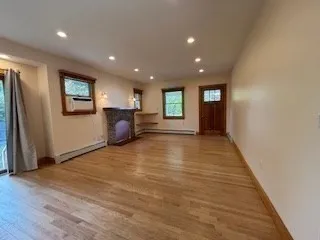 a view of a livingroom with furniture and windows