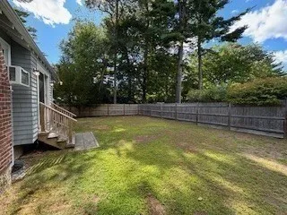 a view of a backyard with swimming pool