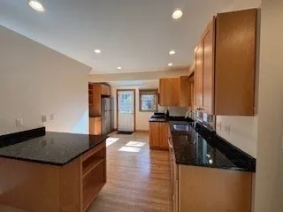 a kitchen with a sink and a refrigerator