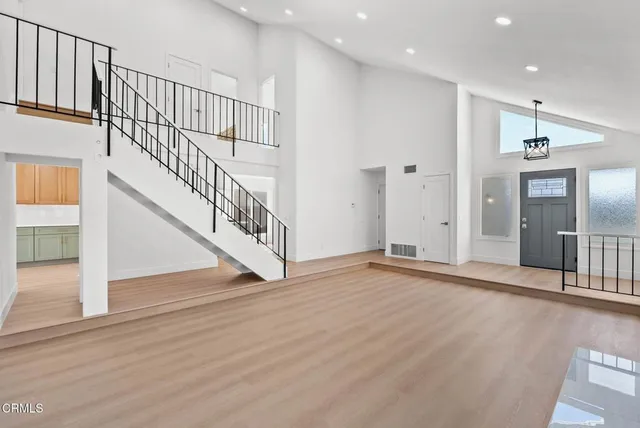 a view of an entryway with wooden floor