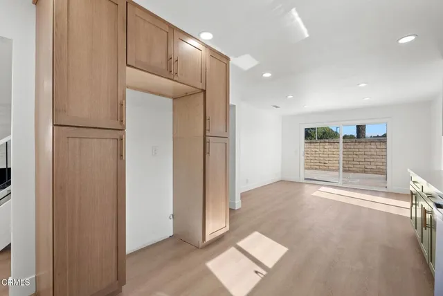 a view of livingroom with an empty space and windows
