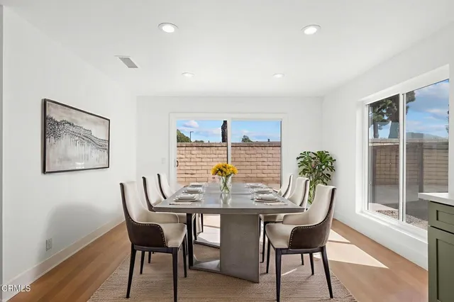a view of a dining room with furniture and window