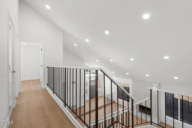 a view of staircase with lots of wooden floor