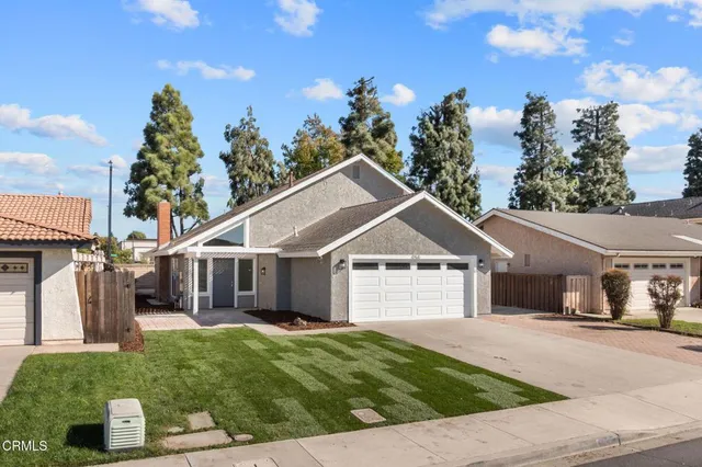 a view of a house with a garden