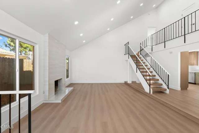 an entryway in a hall with an entryway and wooden floor