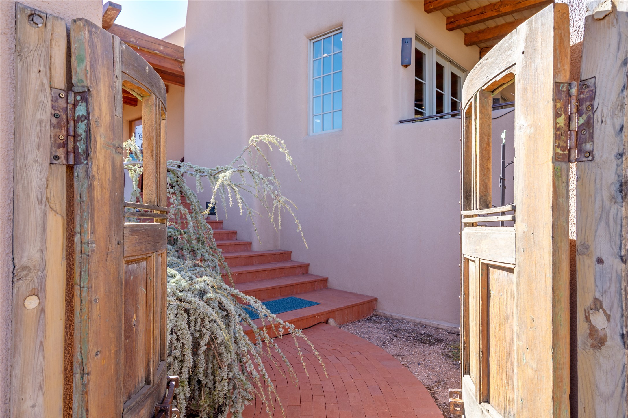 1204 Bandolina Road Santa Fe, NM 87501 - Photo 63 of 69 Stairs to front door, through courtyard gate