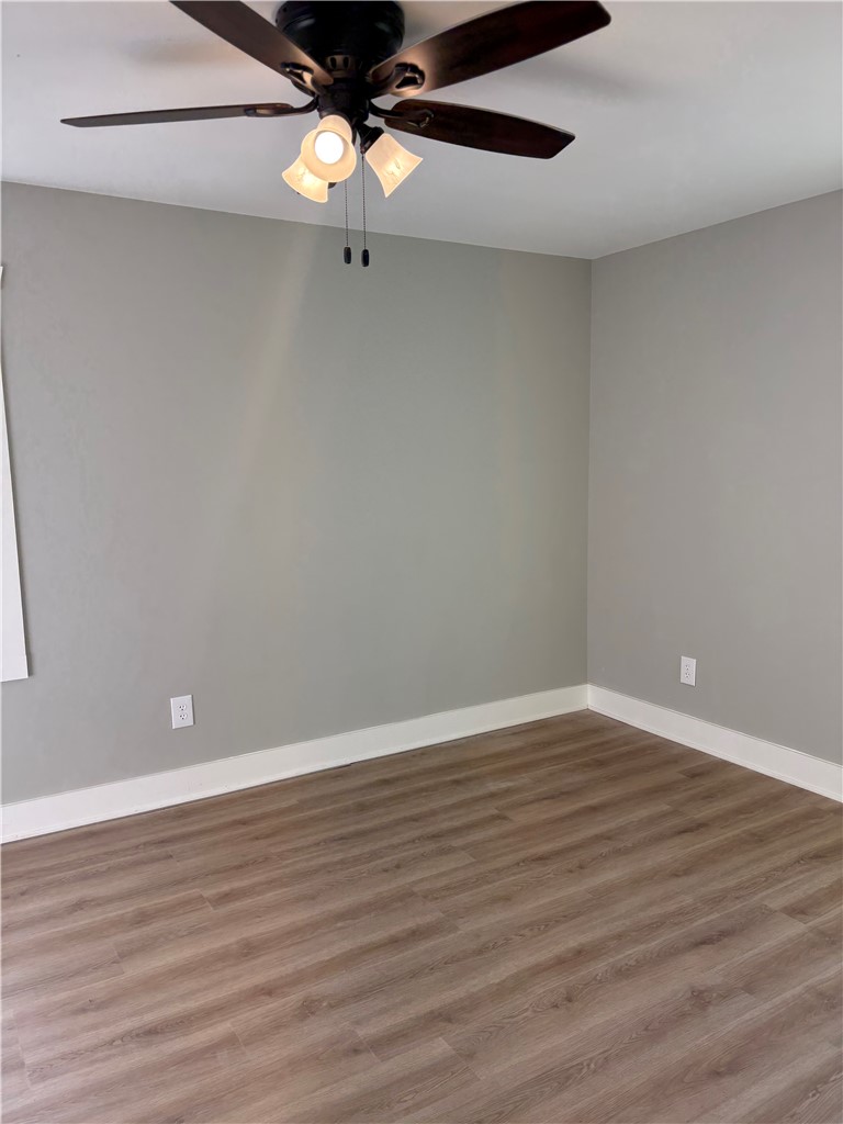 351 Randys Road Westminster, SC 29693 - Photo 23 of 30 A well-lit room featuring durable flooring and a functional ceiling fan.
