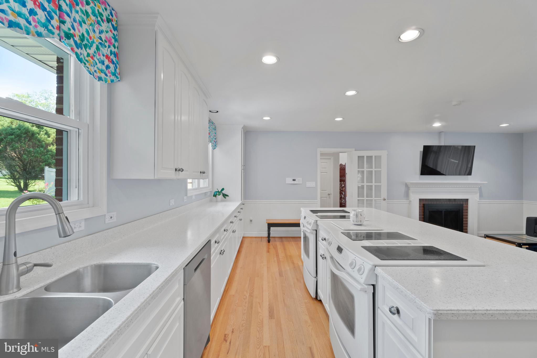 11024 Chandler Road Potomac, MD 20854 - Photo 12 of 44 Solid surface counter & white cabinets