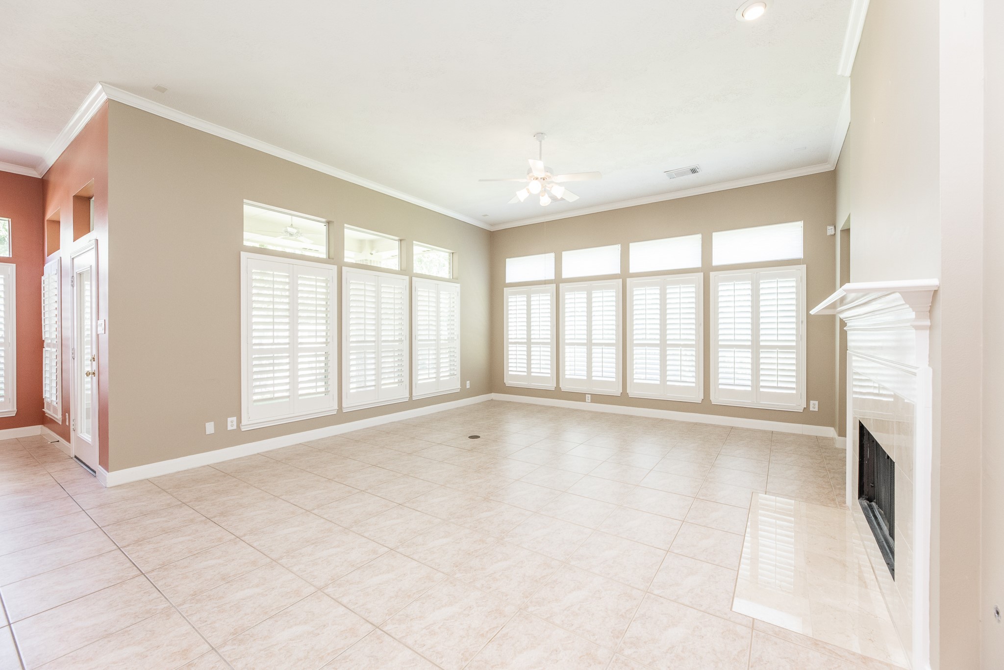 1222 Brinson Court Spring, TX 77379 - Photo 14 of 35 a view of an empty room with a fireplace and a window