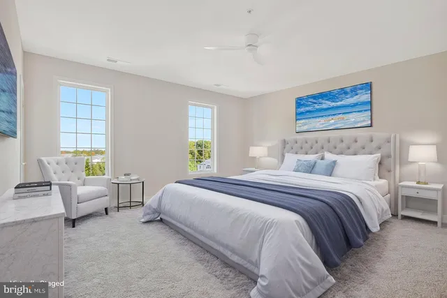 a bedroom with bed and windows