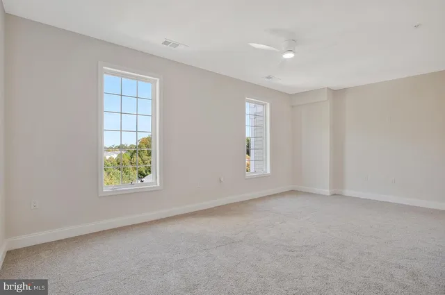 an empty room with windows