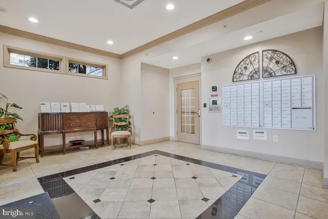 a view of a sign on a wall next to a road