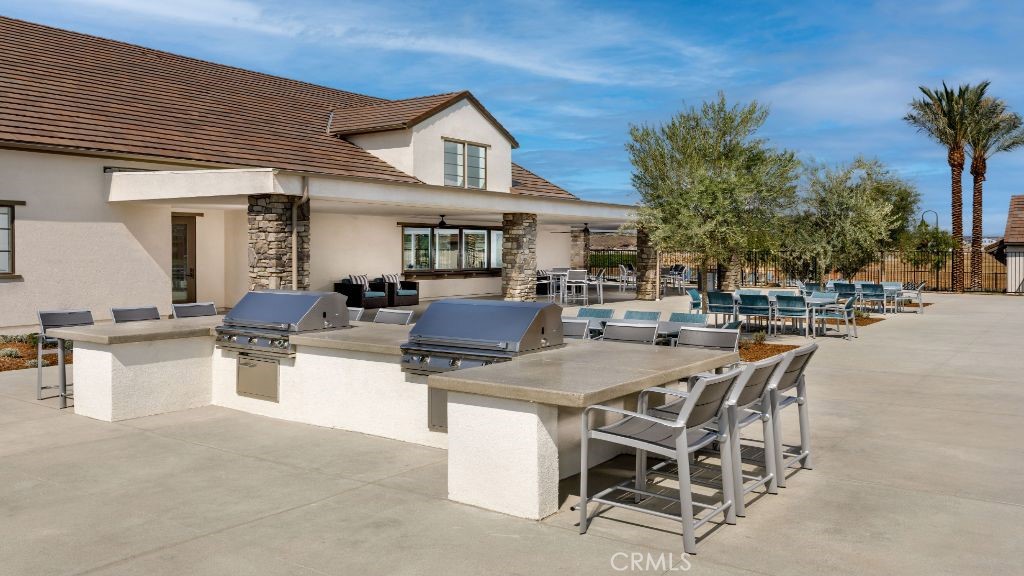 32084 Hyacinth Way Temecula, CA 92591 - Photo 15 of 21 a view of a patio with dining table and chairs