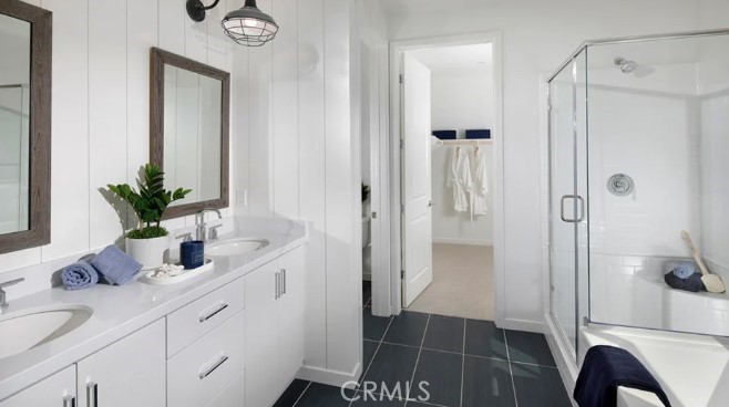 32084 Hyacinth Way Temecula, CA 92591 - Photo 9 of 21 a bathroom with a shower sink and mirror
