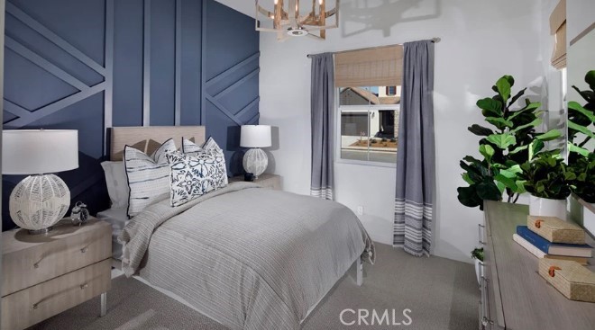 32084 Hyacinth Way Temecula, CA 92591 - Photo 10 of 21 a bedroom with a bed and a potted plant