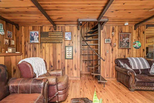 a living room with furniture and a bathtub