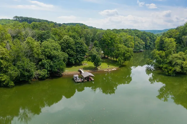 a view of lake with green space