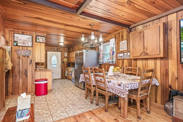 a view of an outdoor dining space with a table and chairs