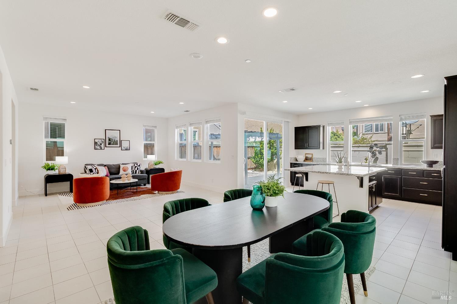 5240 Julia Berger Circle Fairfield, CA 94534 - Photo 1 of 1 a dining room with furniture a rug kitchen view and a chandelier