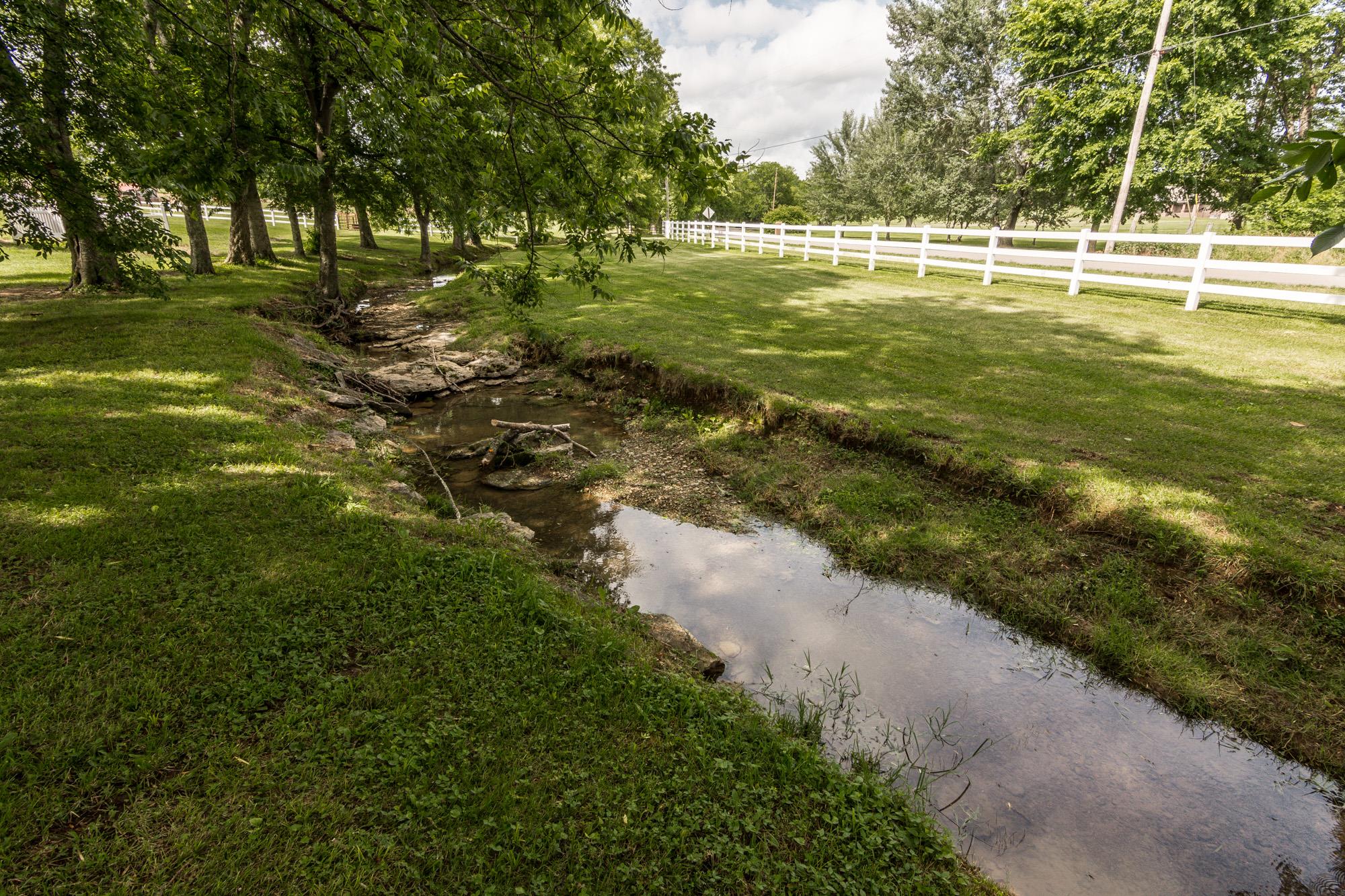 960 Franklin Road Gallatin, TN 37066 - Photo 3 of 21 a view of a swimming pool with a yard and trees