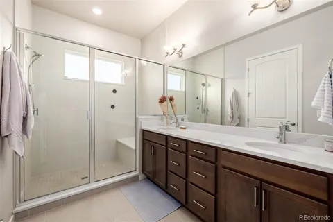 a bathroom with a double vanity sink mirror and double
