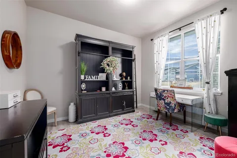 a bedroom with a bed and a table in it