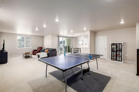 a living room with furniture a table and a window