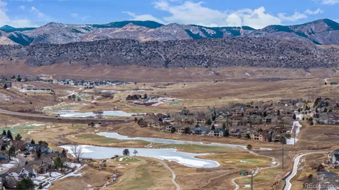 a view of a town with mountains in the background