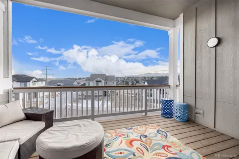 a view of a balcony with furniture