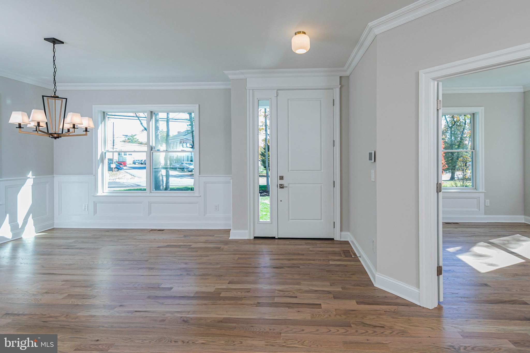 576 Ewing Street Princeton, NJ 08540 - Photo 2 of 61 a view of an empty room with wooden floor and a window