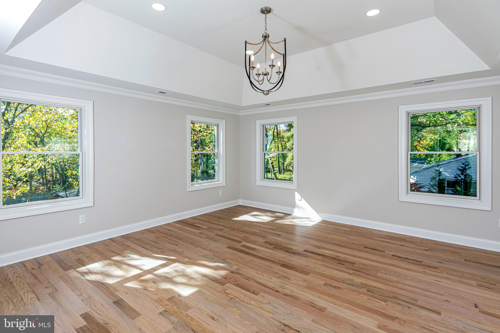576 Ewing Street Princeton, NJ 08540 - Photo 31 of 61 a view of an empty room with wooden floor and a window