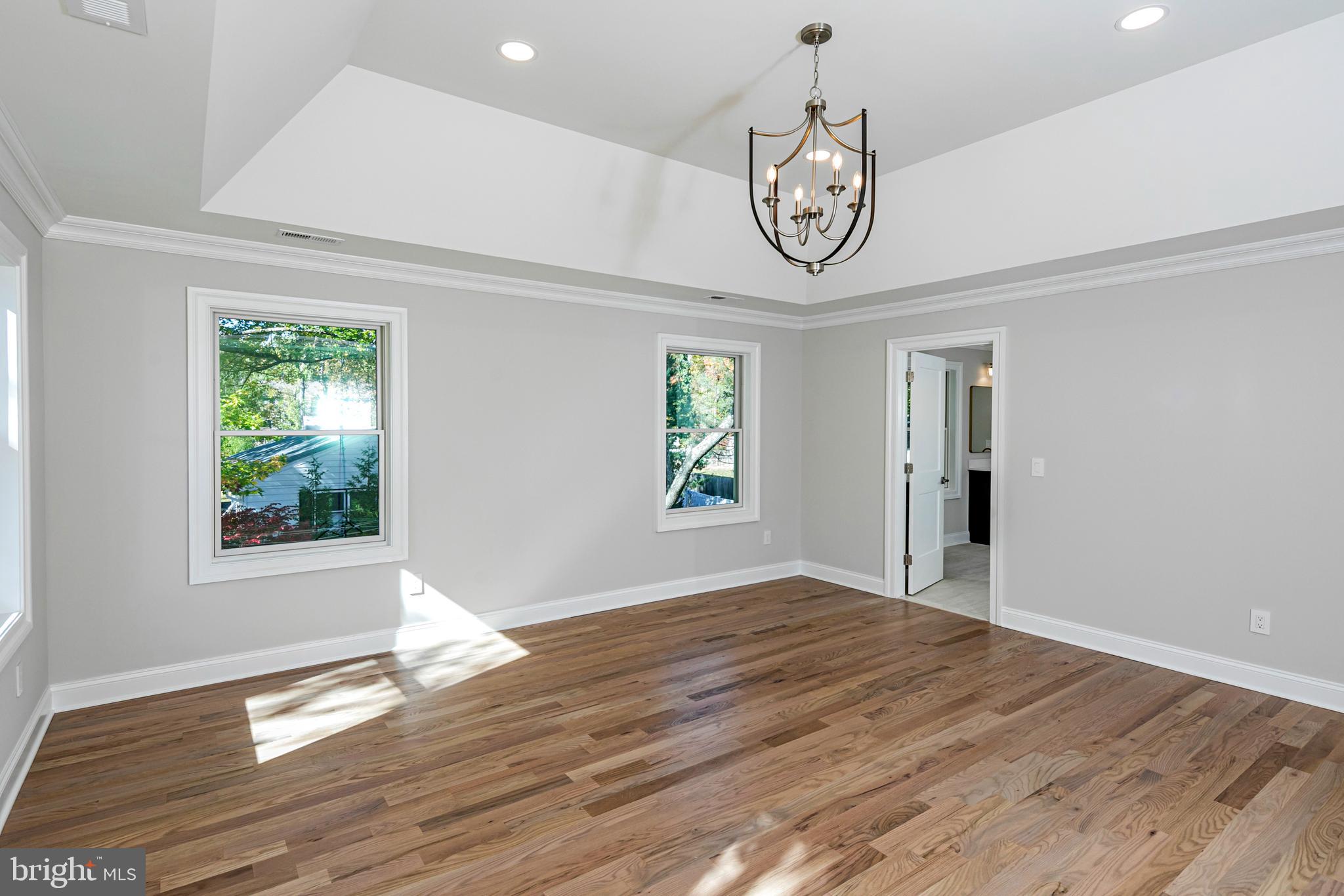 576 Ewing Street Princeton, NJ 08540 - Photo 33 of 61 a view of an empty room with window and wooden floor