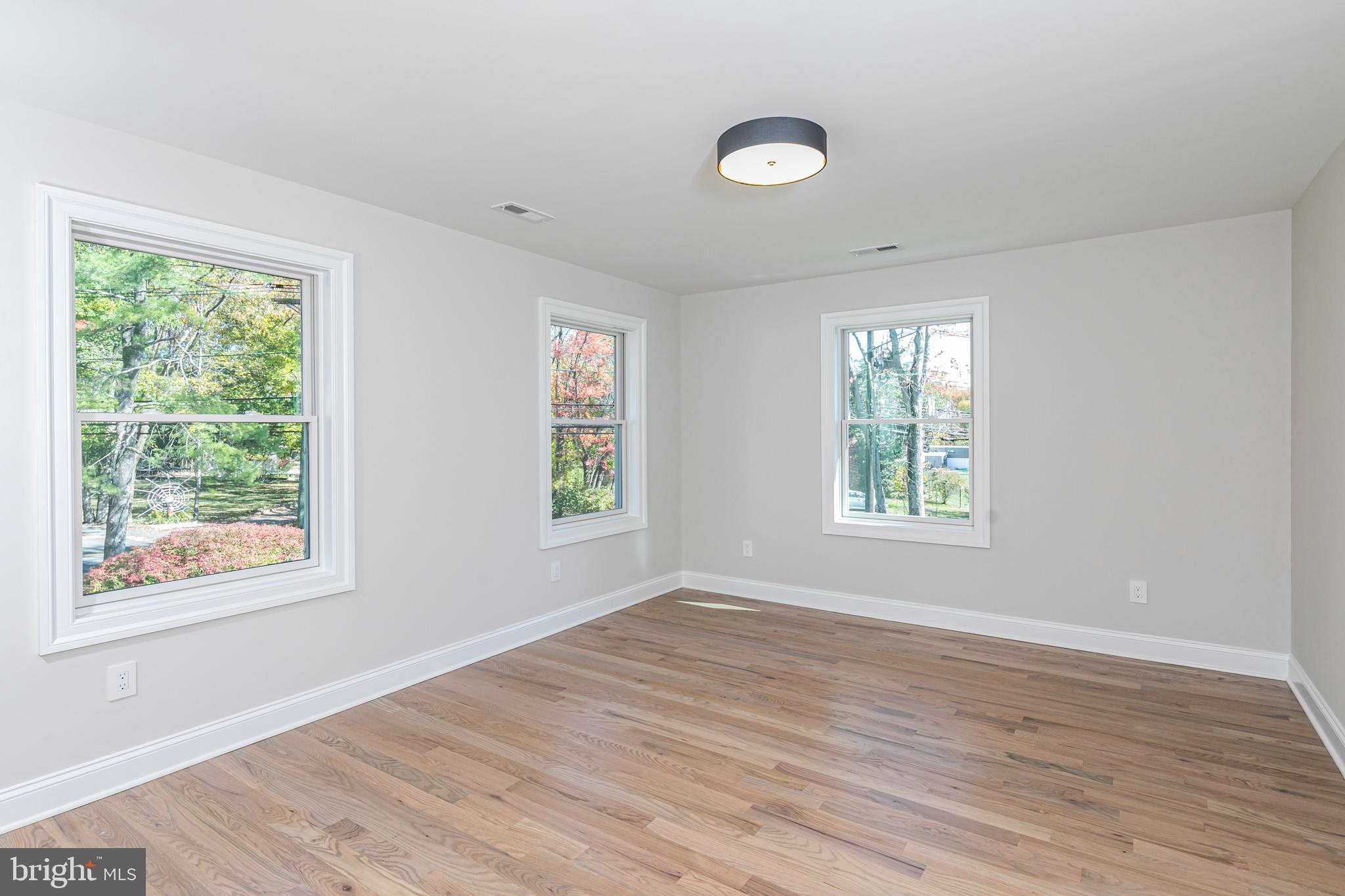 576 Ewing Street Princeton, NJ 08540 - Photo 39 of 61 a view of an empty room with wooden floor and a window