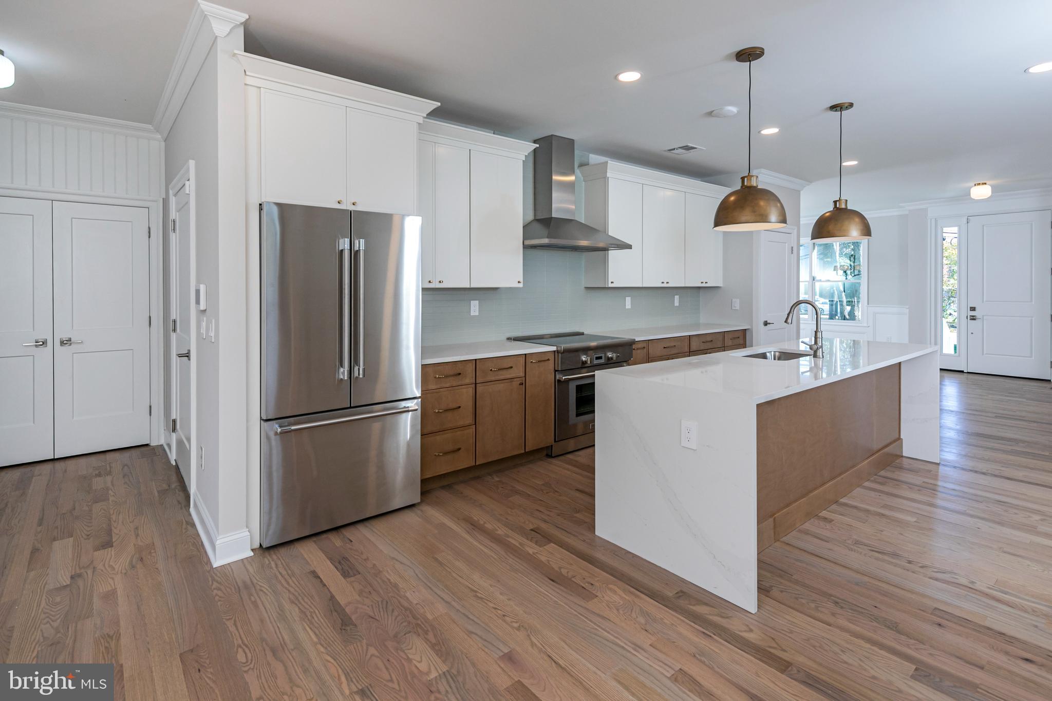 576 Ewing Street Princeton, NJ 08540 - Photo 10 of 61 a kitchen with stainless steel appliances granite countertop a refrigerator a sink dishwasher a stove and a wooden floors