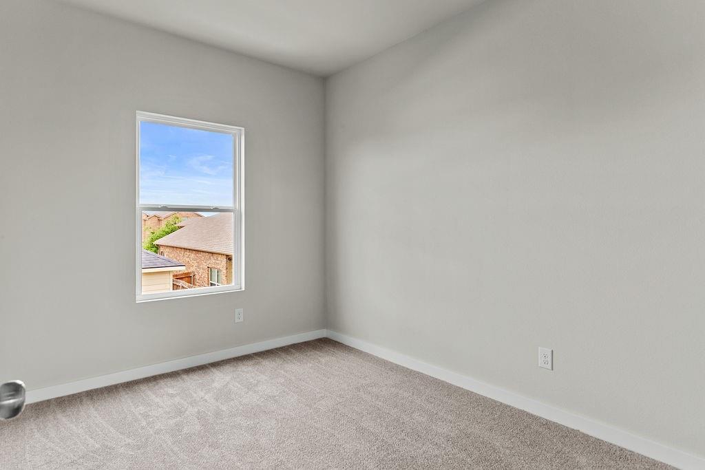 620 Alameda Road Azle, TX 76020 - Photo 21 of 27 an empty room with a window