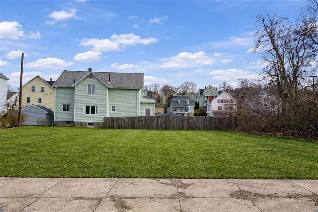 11 Dyer Street Fall River, MA 02720 - Photo 2 of 6 a view of a big house with a big yard and potted plants
