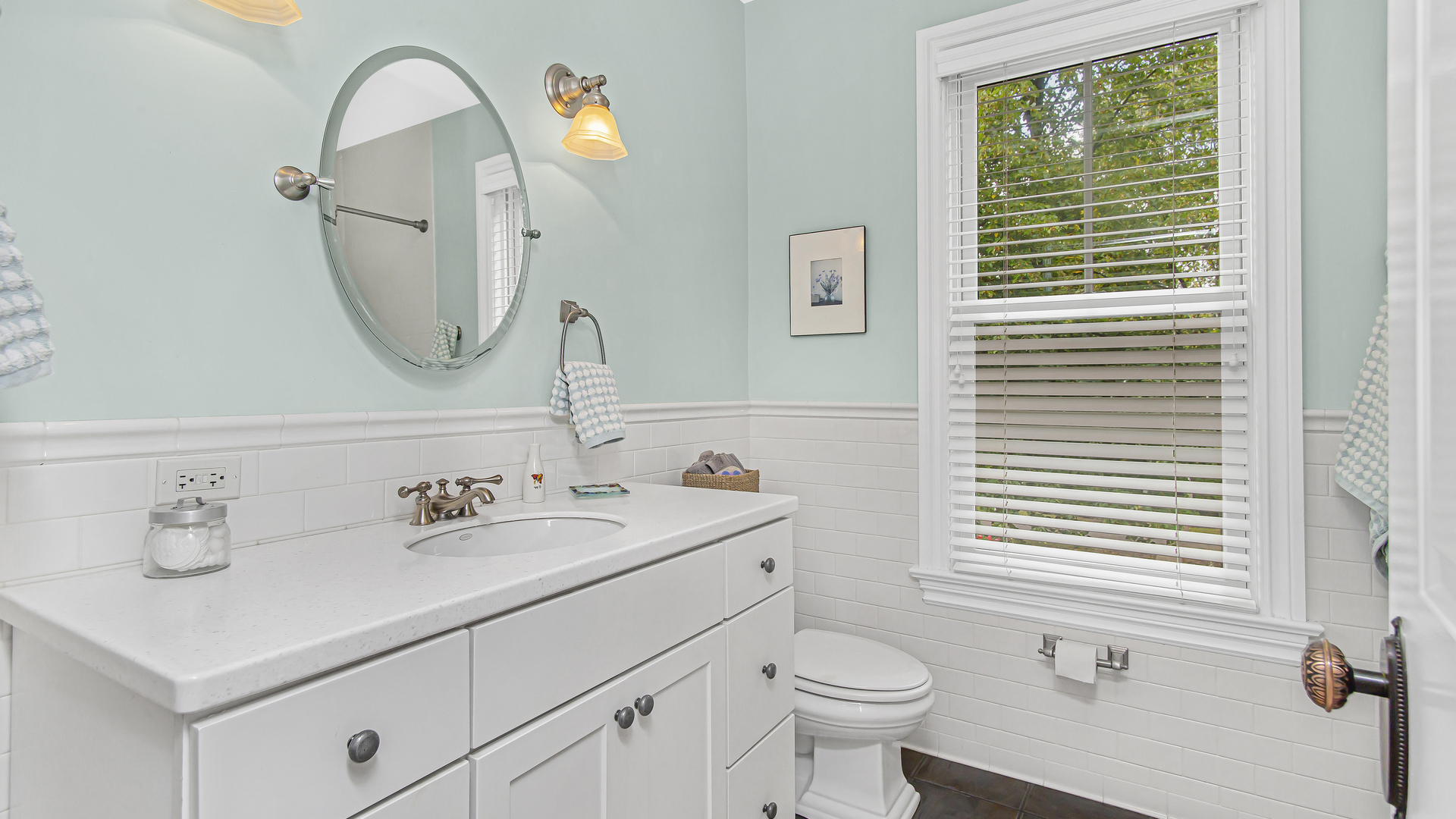 Undisclosed Address Evanston, IL 60201 - Photo 16 of 30 a bathroom with a sink a toilet and a mirror