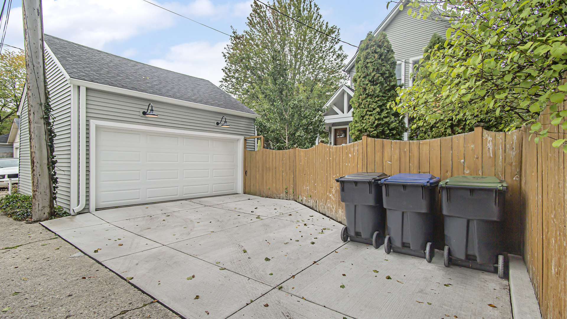 Undisclosed Address Evanston, IL 60201 - Photo 26 of 30 a view of backyard with table and chairs and a large tree