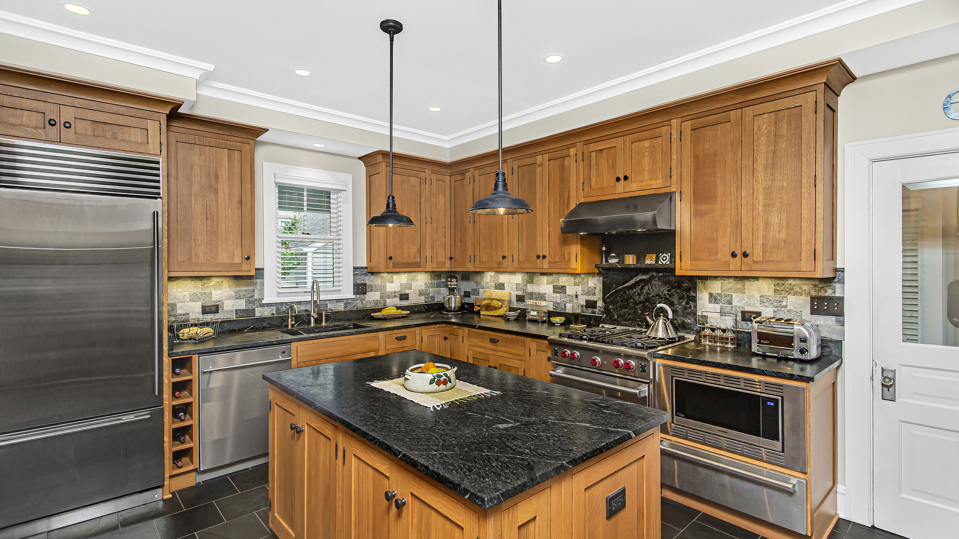 Undisclosed Address Evanston, IL 60201 - Photo 5 of 30 a kitchen with stainless steel appliances granite countertop a stove a sink and a microwave